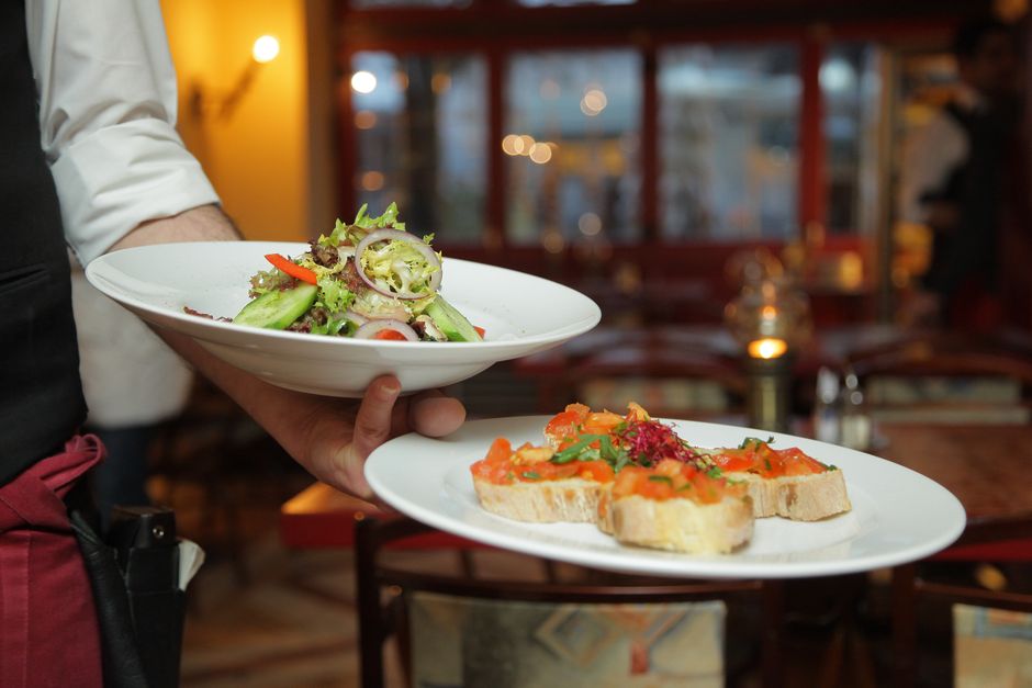 What Do Restaurant Service Charges and Automatic Gratuities Mean?